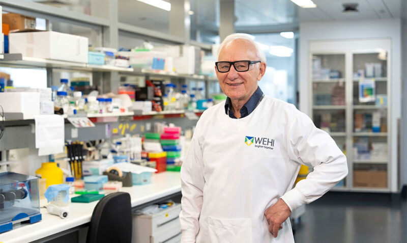 Photo of Professor Len Harrison standing in a laboratory
