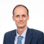 Portrait of Andrew Evans against a plain white background