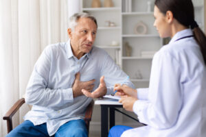 A photo shows a patient with a doctor in a medical consultation